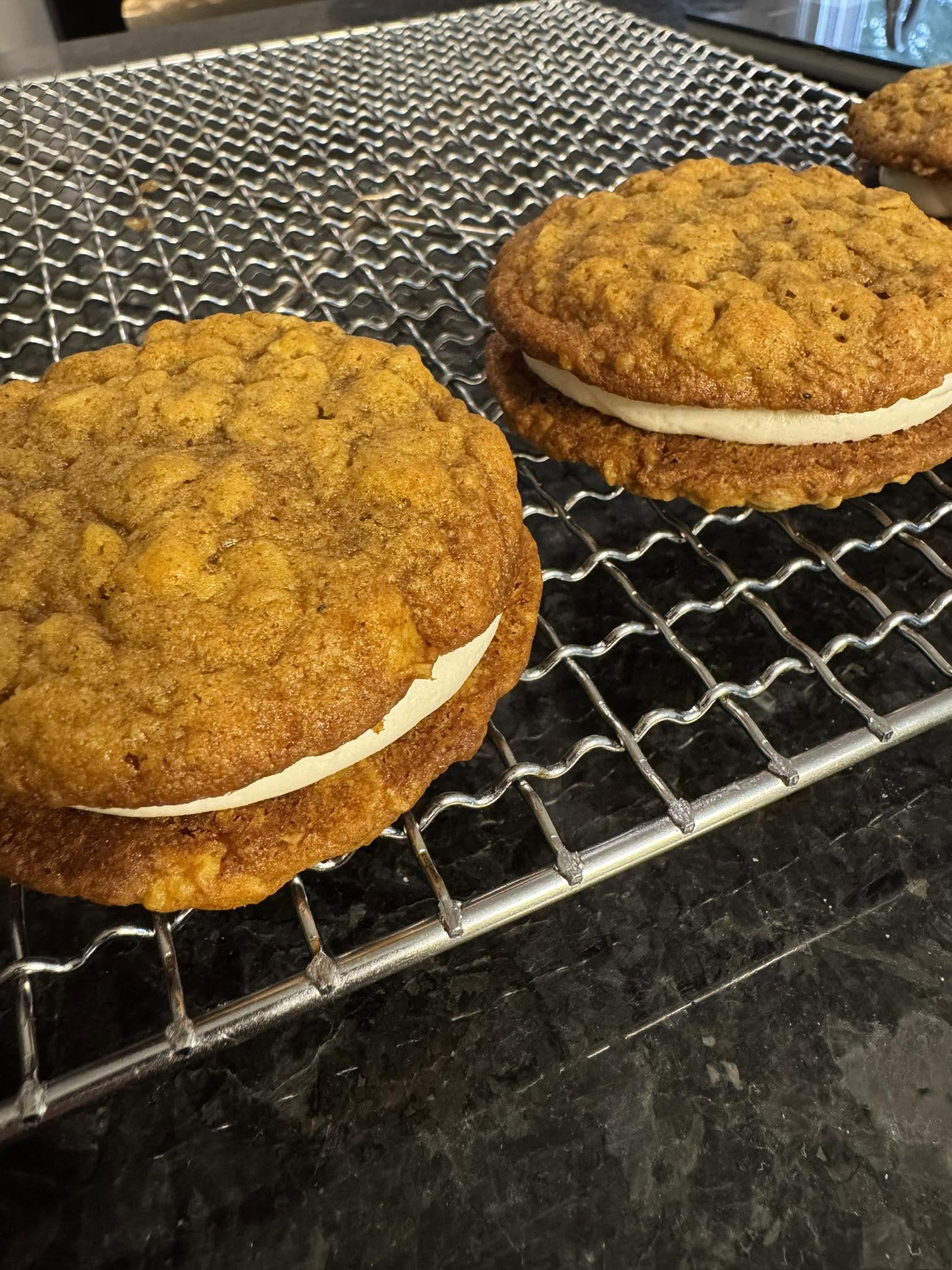 Freshly baked oatmeal pies on a cooling rack
